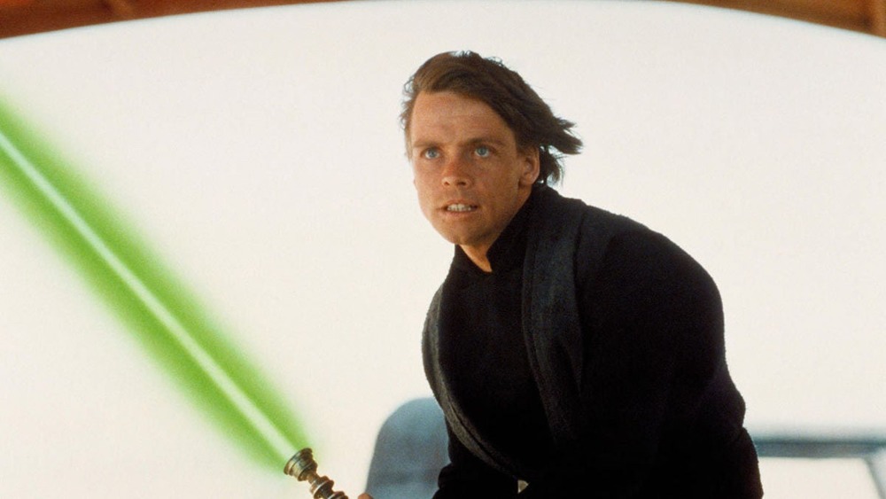 Luke Skywalker holding green lightsaber