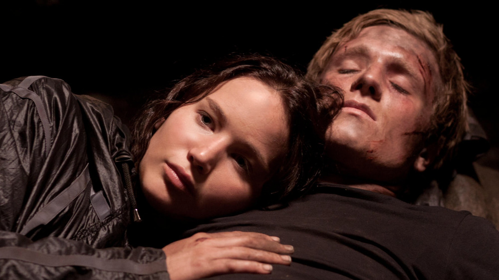 Katniss tends to Peeta